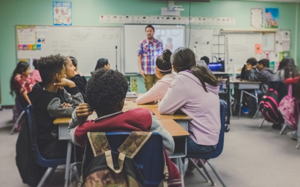 teacher standing in front of a classroom